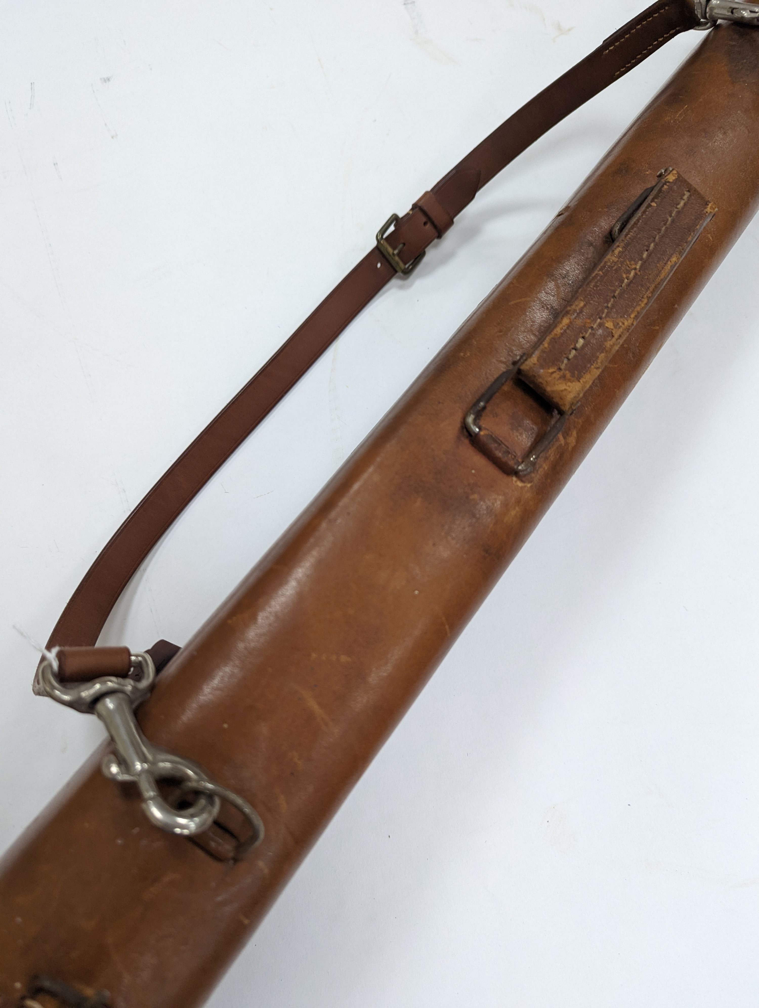 A leg of mutton shaped leather gun case